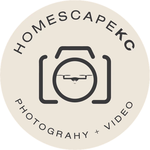 HomescapeKC camera badge, charcoal on cream
